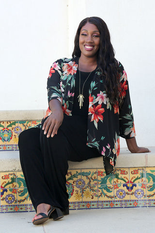 woman wearing a sheer floral print jacket