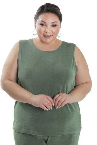 woman wearing a sage green sleeveless shell top