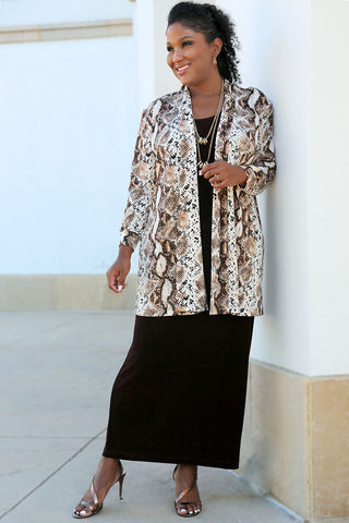 woman wearing a maxi dress and print duster jacket