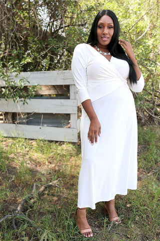 woman wearing a white faux wrap dress