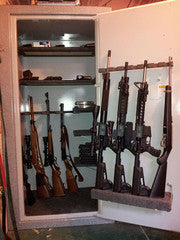 gun safe rifles on door