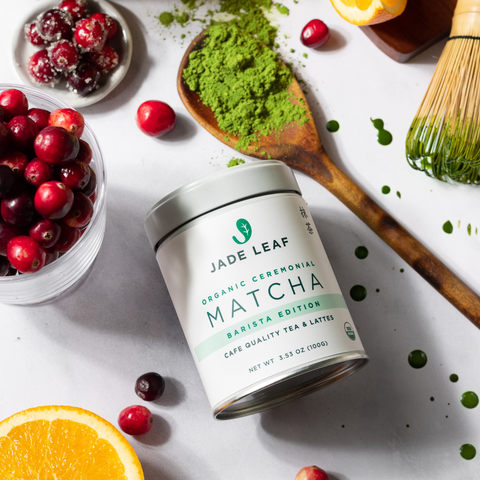 Barista Ceremonial Matcha Tin next to a spoonful of matcha and cranberries