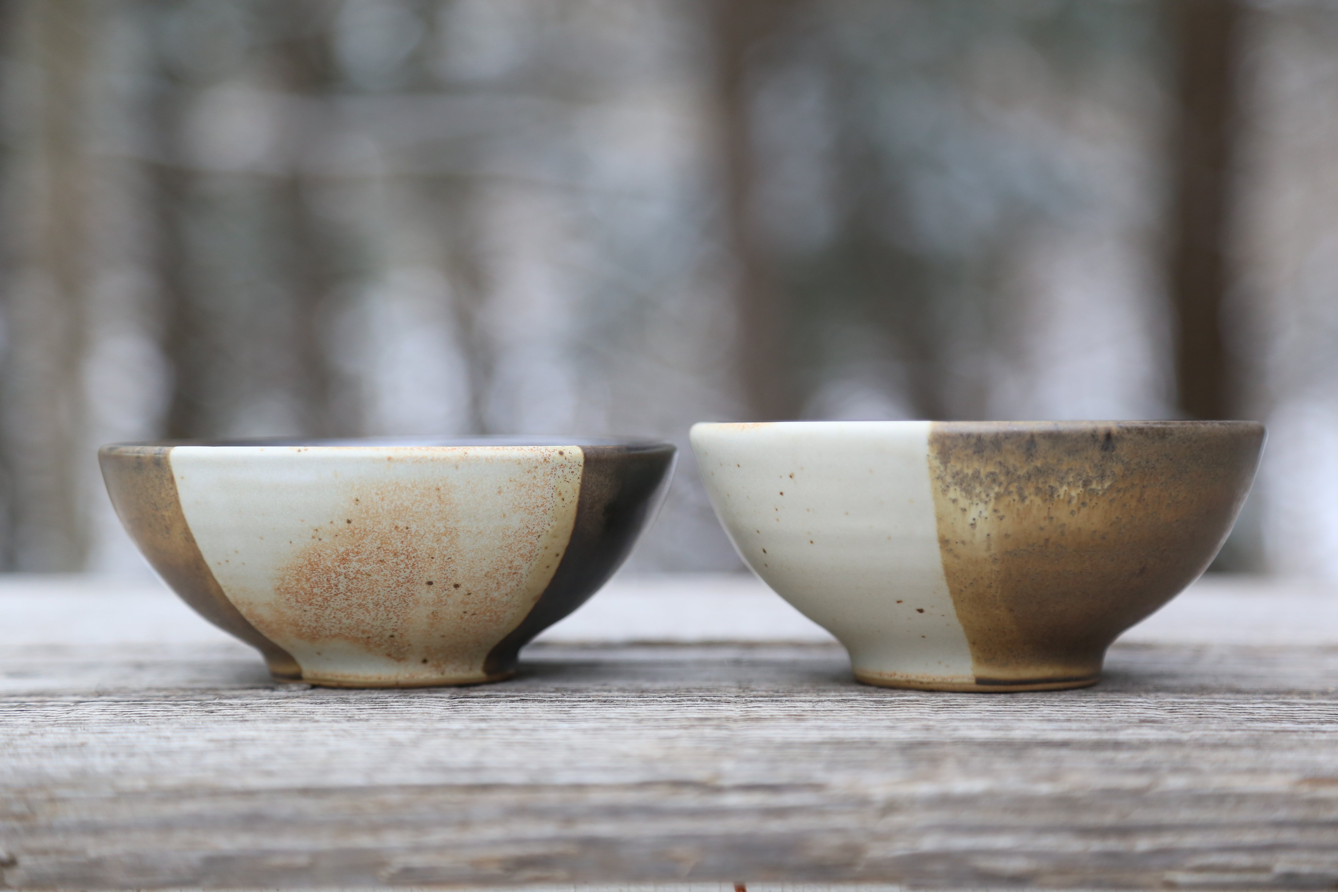 Two tri-colored small bowls