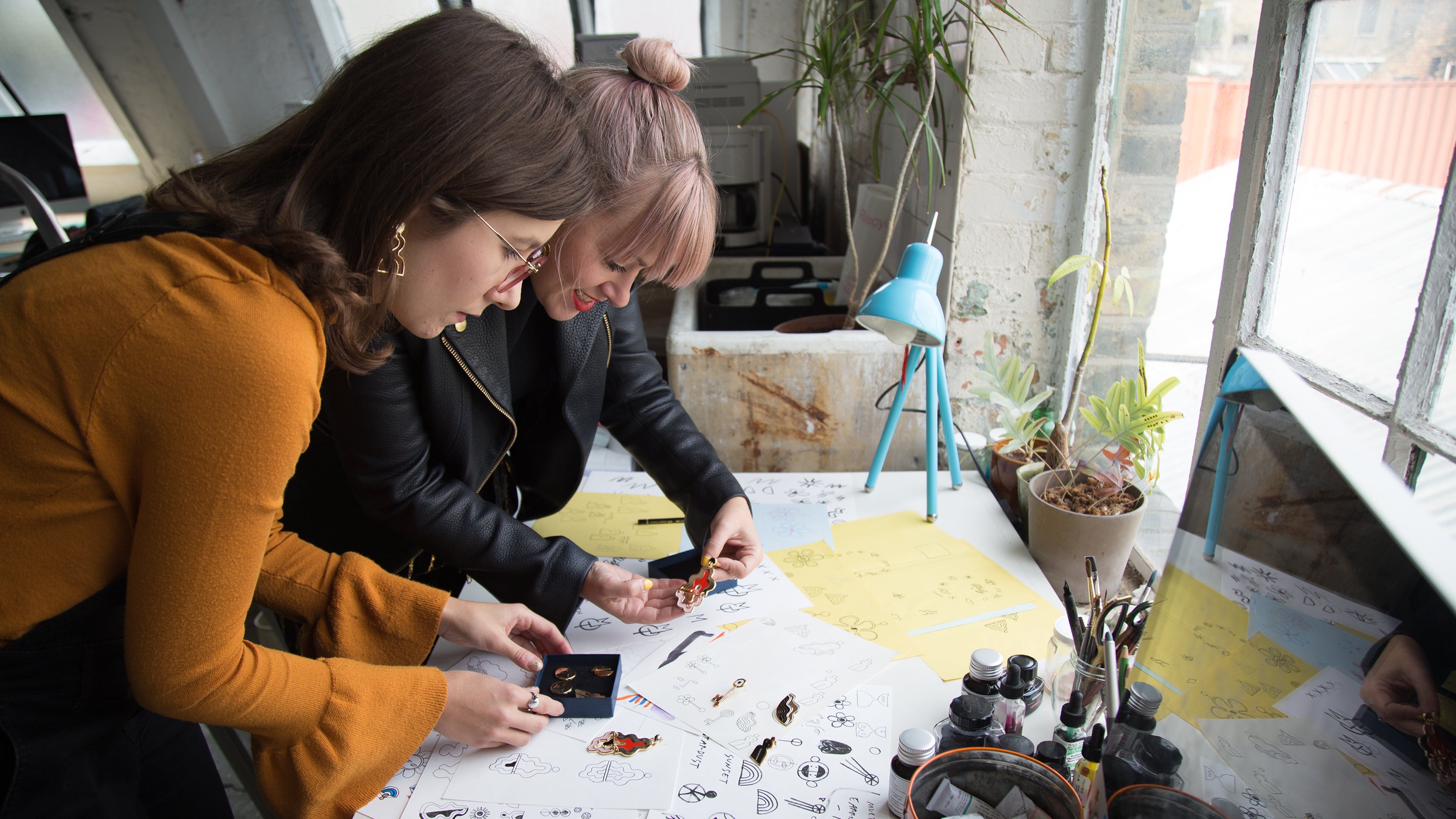 Ernestina and Maria working on earring designs