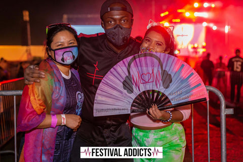 3 ravers with festival fan