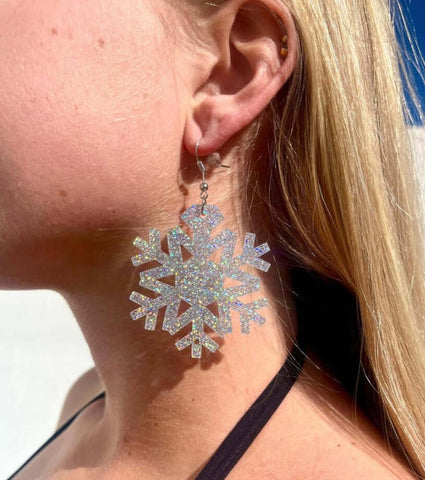 woman wearing snowflake earring