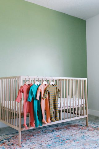 RAGS newborn rompers in baby room