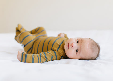 Striped Newborn Romper with Baby Laying Down