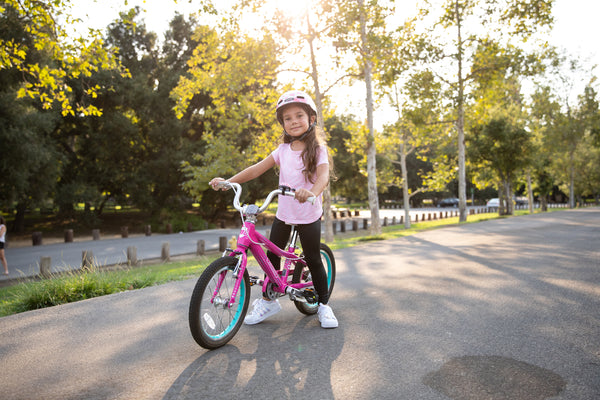 Little girl on a pink 16" Guardian Bike