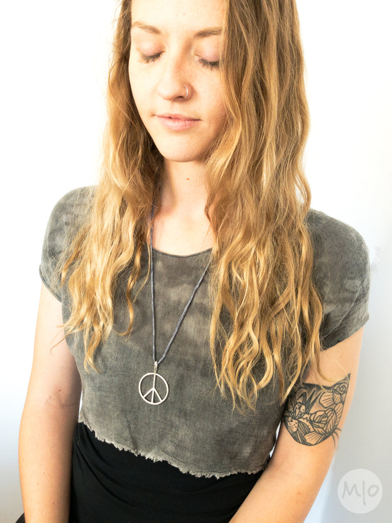 Katherine wearing peace pendant at Melissa Osgood Studio.