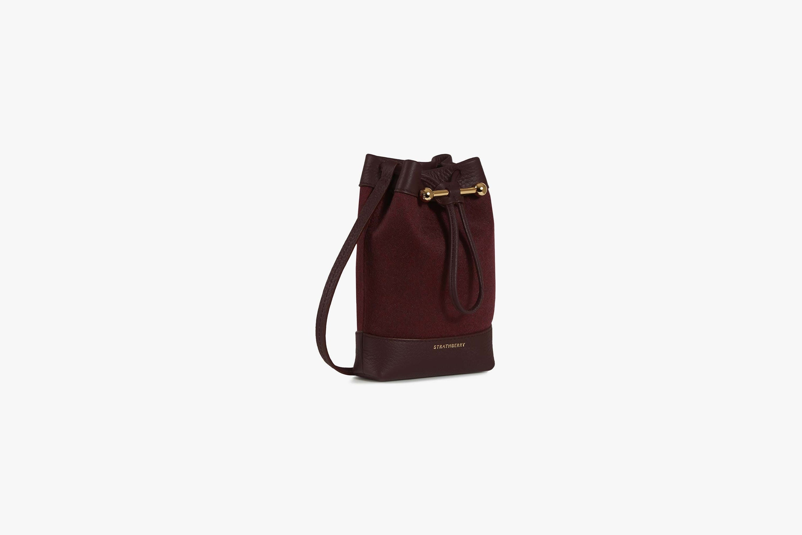 A view showcasing our Osette Pouch - Cashmere Wool Wine/Burgundy