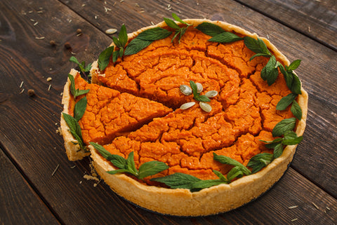 pumpkin cake bright orange with green leaves