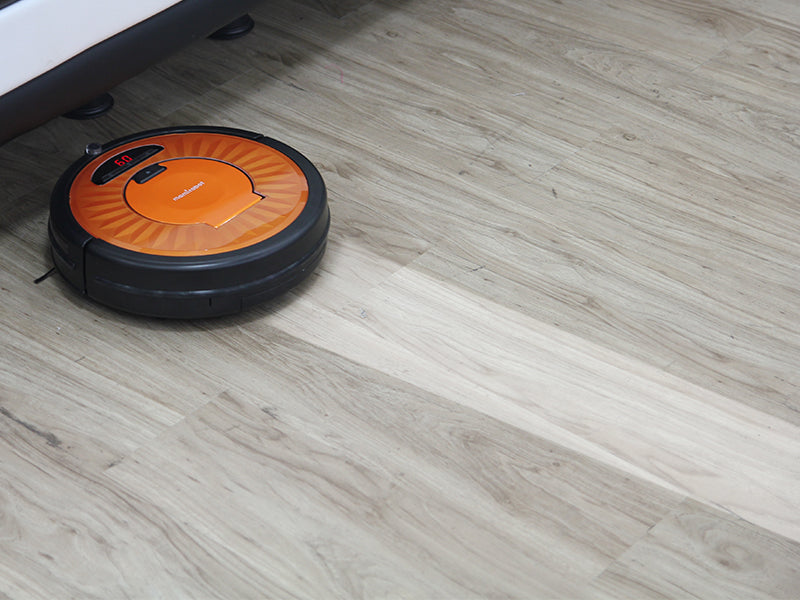 robot vacuum cleaner on wood floor