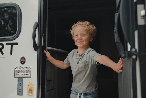 Young boy in travel trailer