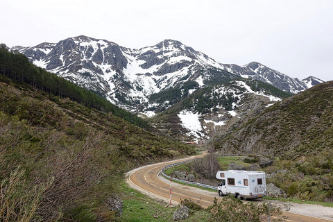 Camper driving through mountains