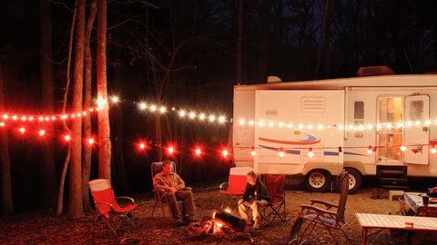 An RV with a string of lights outside