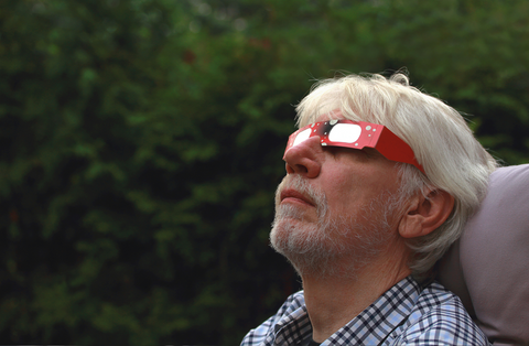 Man with Solar Eclipse Glasses