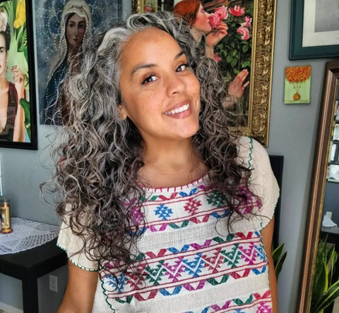 Latina woman with silver curly hair