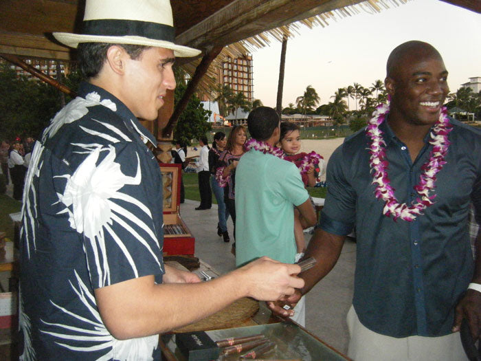 Dallas Cowboys outside linebacker, DeMarcus Ware, having a wonderful time picking out a cigar.