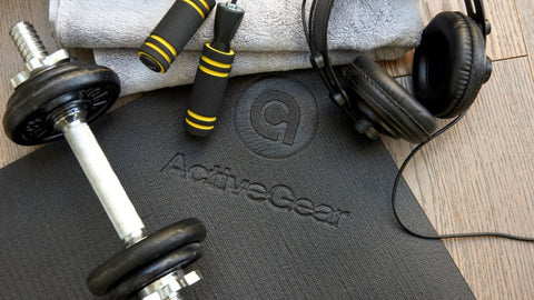 workout equipments on large exercise mat