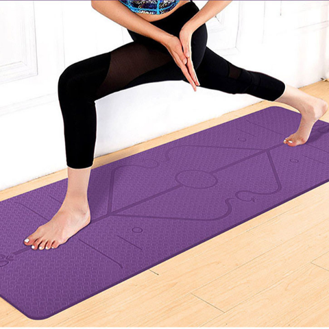 Woman using a purple yoga mat workout