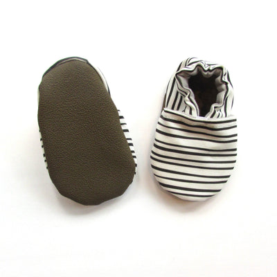 white canvas baby shoes