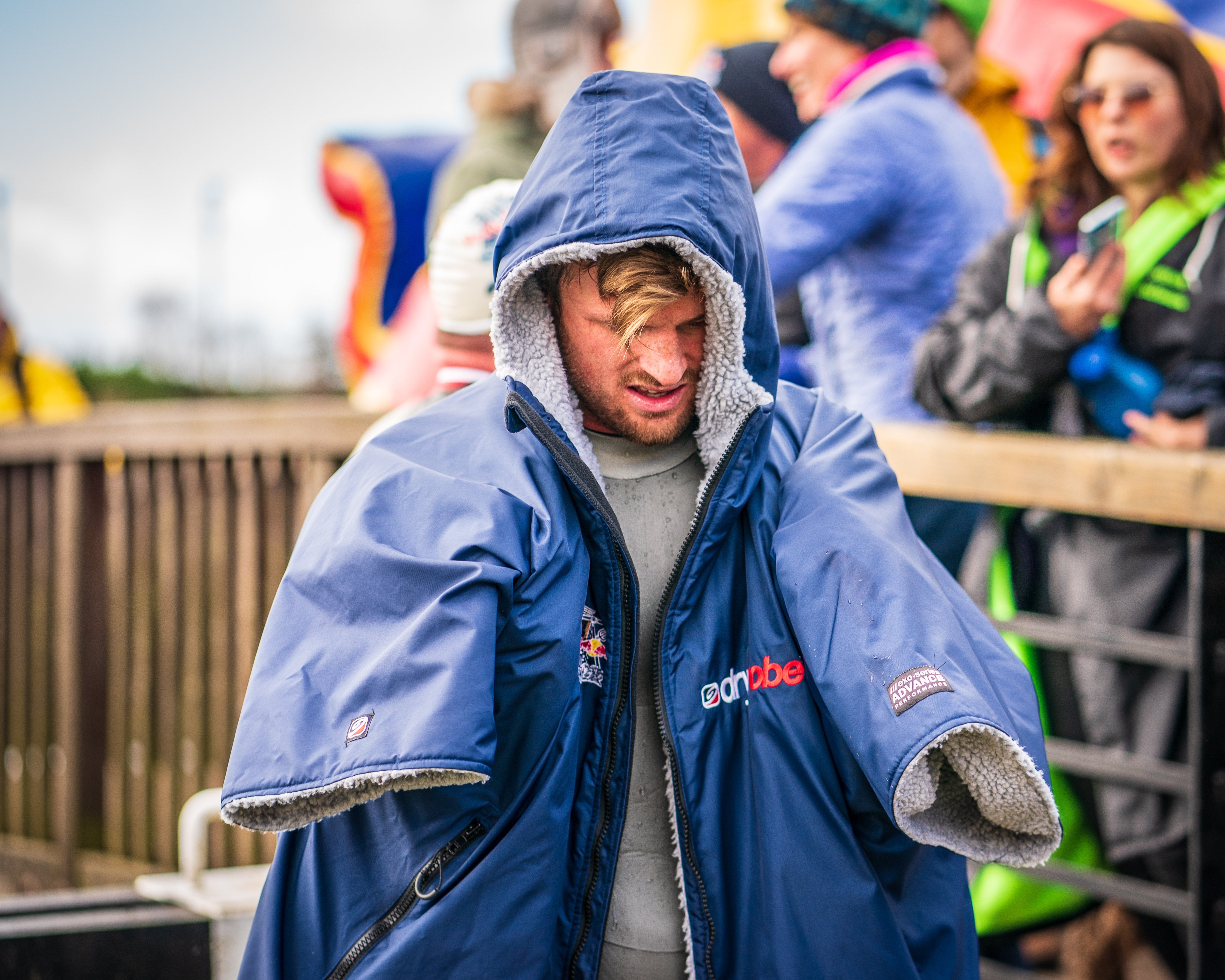 Competitor at Red Bull Neptune Steps staying warm in a dryrobe