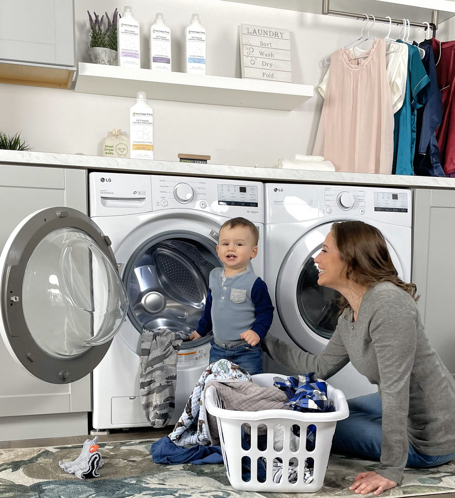 woman and toddler doing laundry together