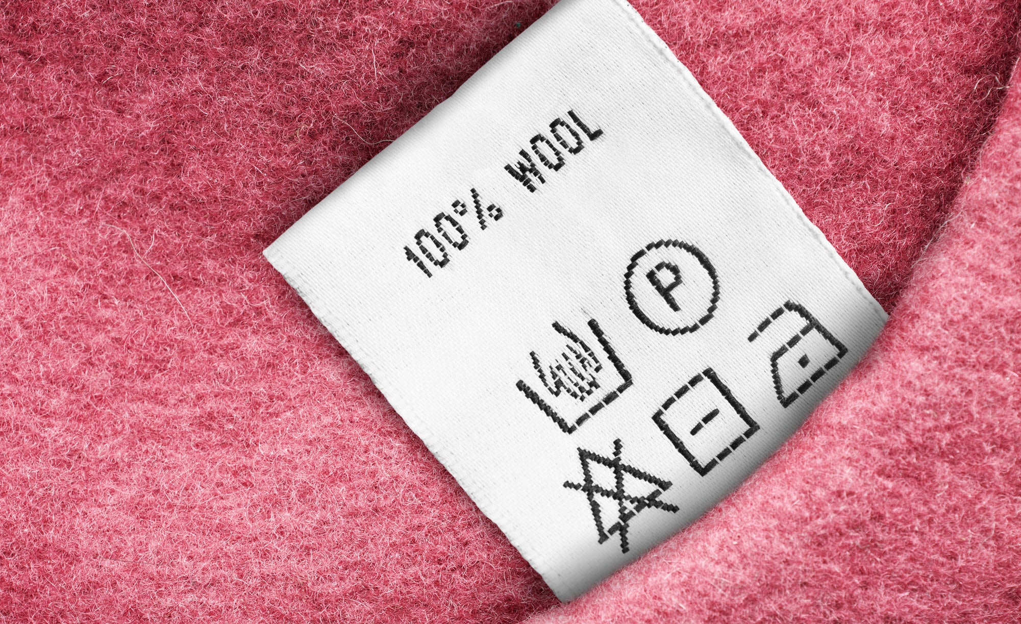 Reading a care label for a wool garment