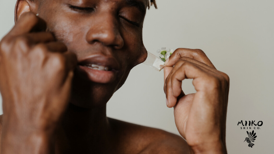 man with plants taped to his face