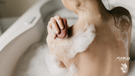 girl in bath with konjac sponge