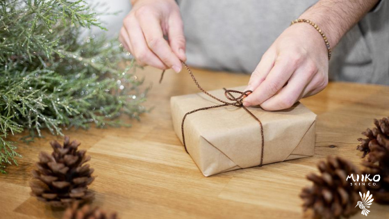 sustainably wrapping a gift with craft paper