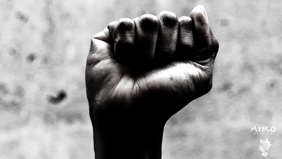 Black and white image of fist raised in the air
