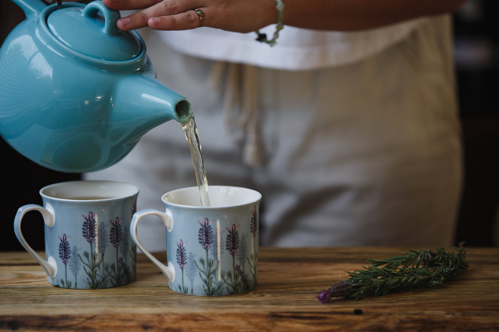 pouring tea into a teacup