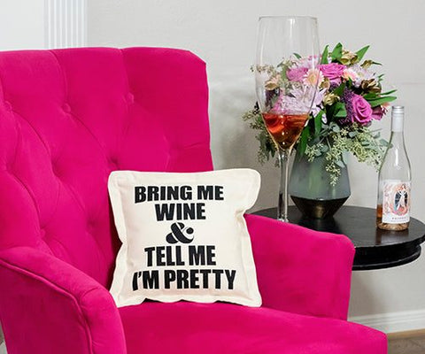 square, beige cotton canvas throw Pillow with text that reads "Bring Me Wine And Tell Me I'm Pretty"