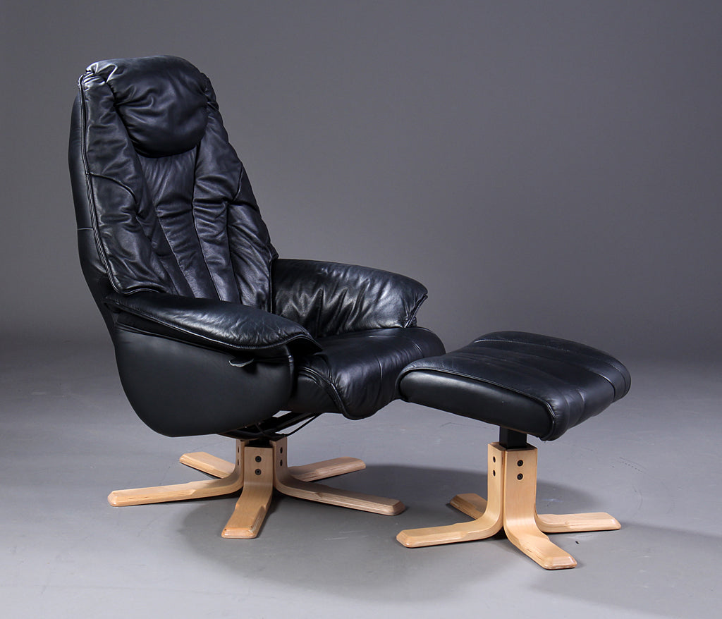 black leather chair and stool