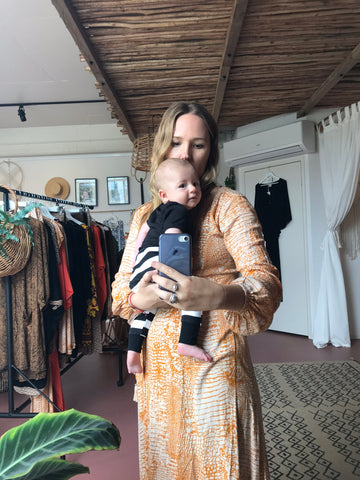 Baby at boutique with designer working mum Byron Bay