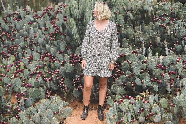 Verity, Head Designer of Dreamers & Drifters, in long sleeve babydoll dress Cheetah at Cactus Country