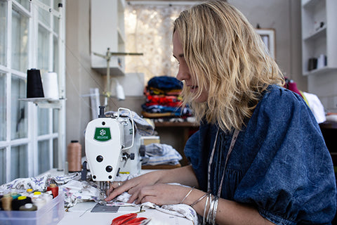 Fashion designer sewing