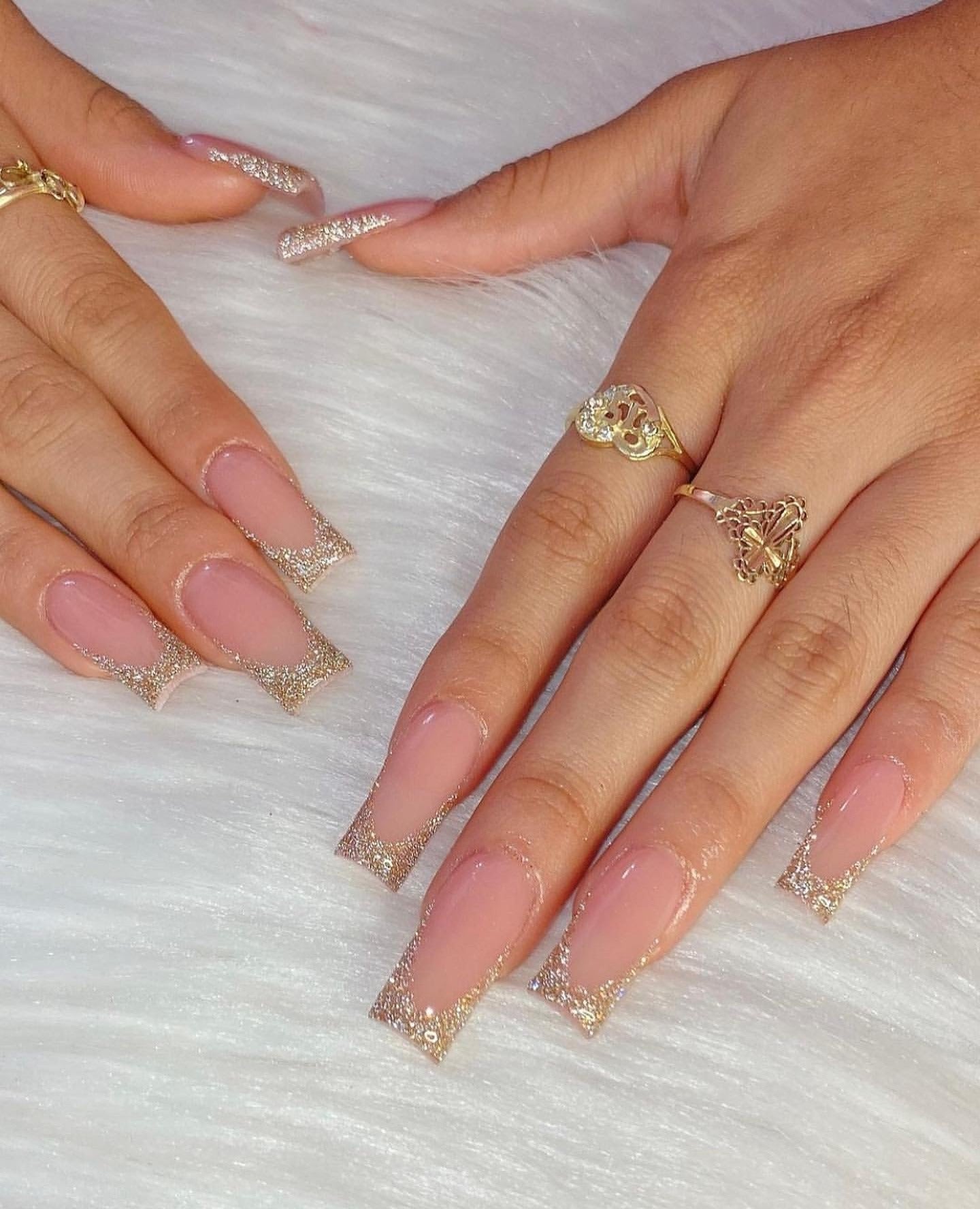 17. Classic Nude with Gold Glitter French Tips (Nail Ideas with Gold)