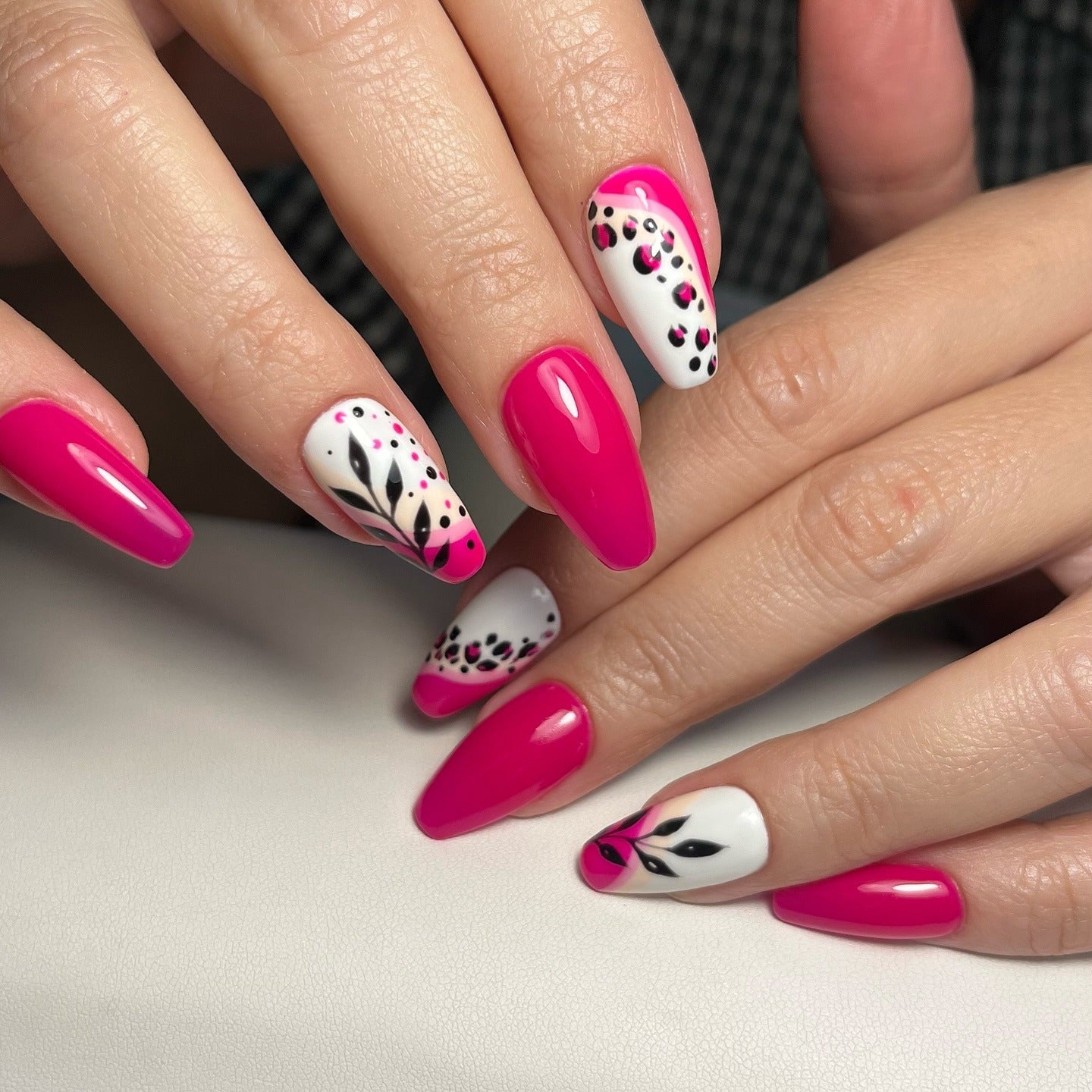 18. Hot Pink Floral Vibe – Glossy with Black & White Accents (Pink Nail Ideas)