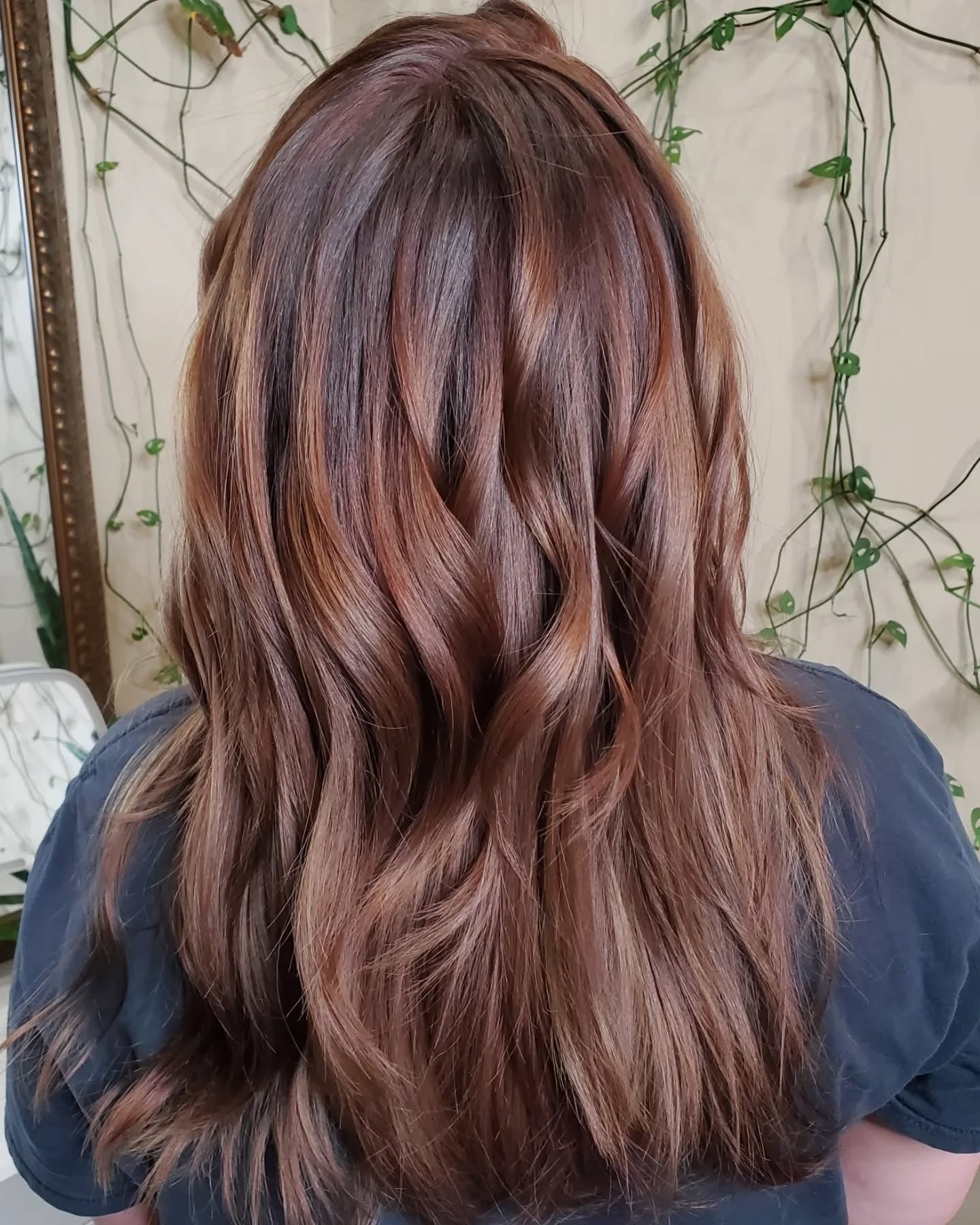 2. Warm Chestnut Layers with Glossy Finish (Chocolate Brown Hair with Highlights)