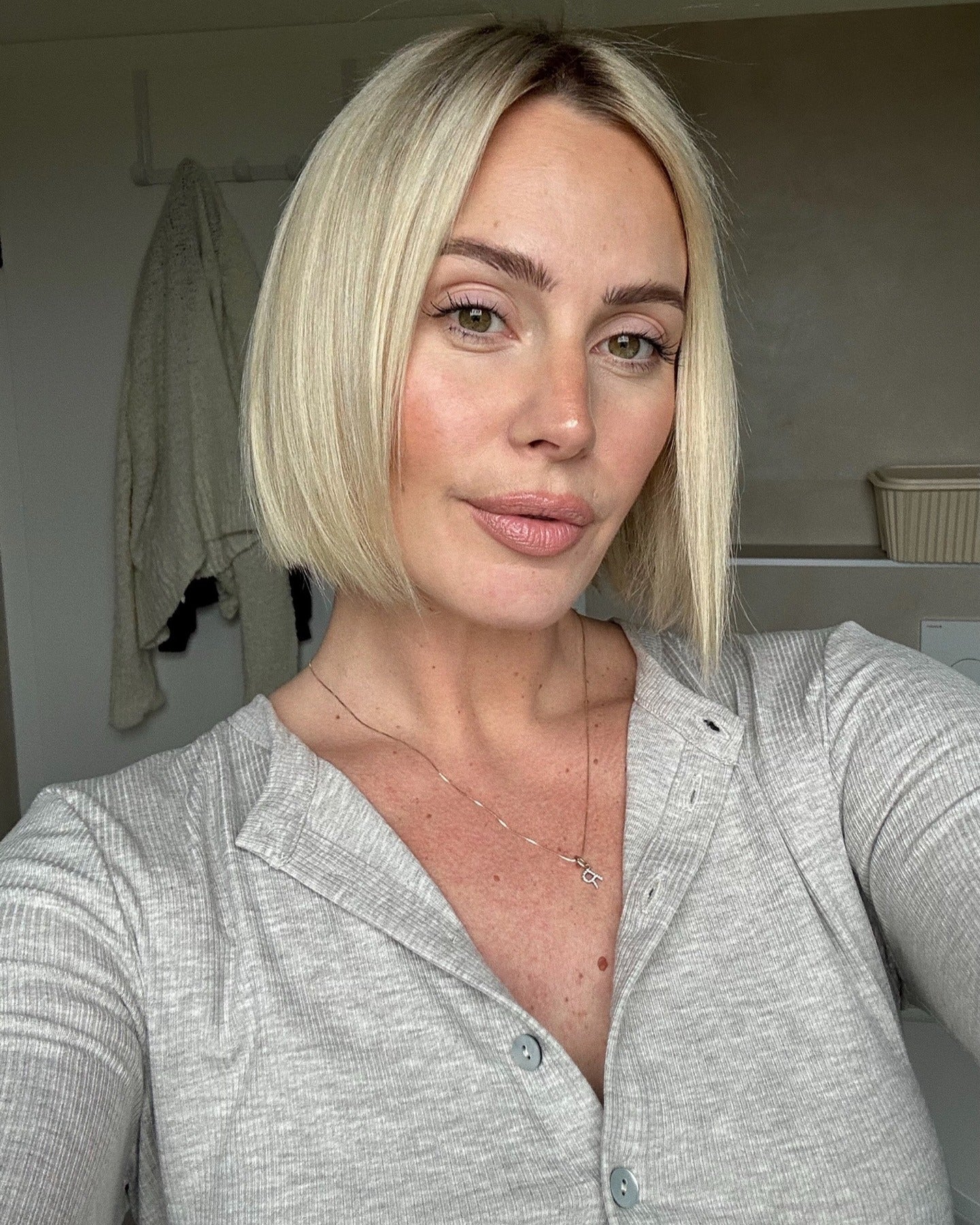 23. Polished Blonde Bob with a Center Part (Bob Hairstyles)