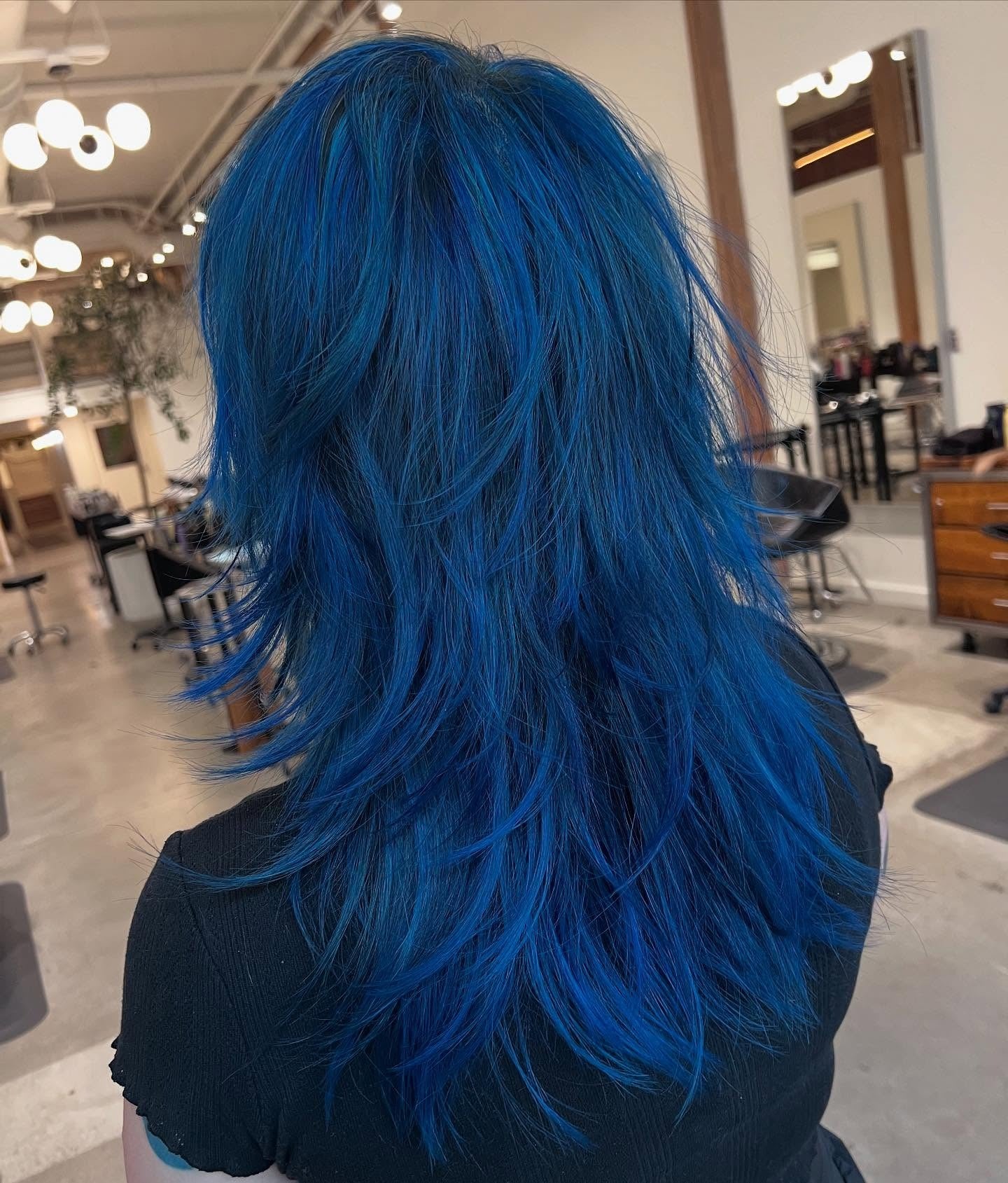 3. Feathered Cobalt Shag (Blue Hair Color)