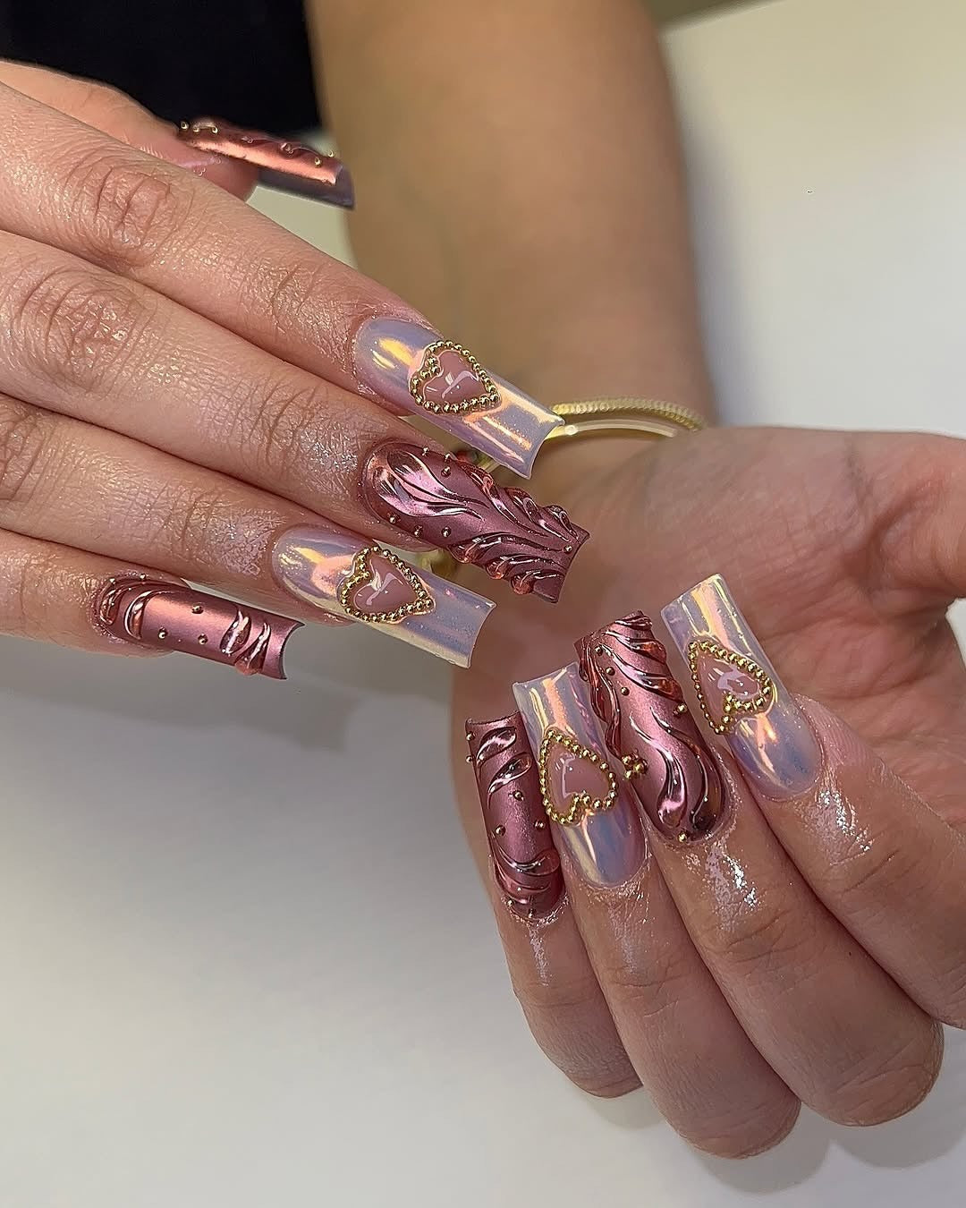 6. Chrome Heart Coffins in Rose Gold and Holographic Shine (Bling Nail Ideas)