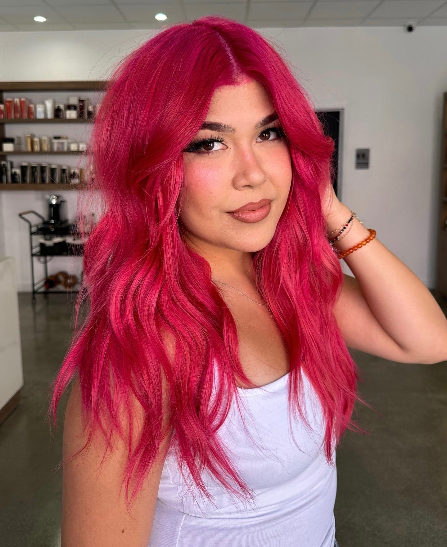 6. Vibrant Fuchsia Layers with Face-Framing Volume (Pink Hair Color)