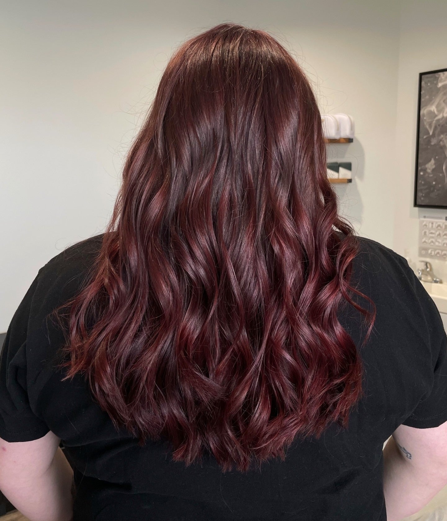 7. Glossy Burgundy-Red Curls on Chestnut Base (Black Cherry Hair Color)