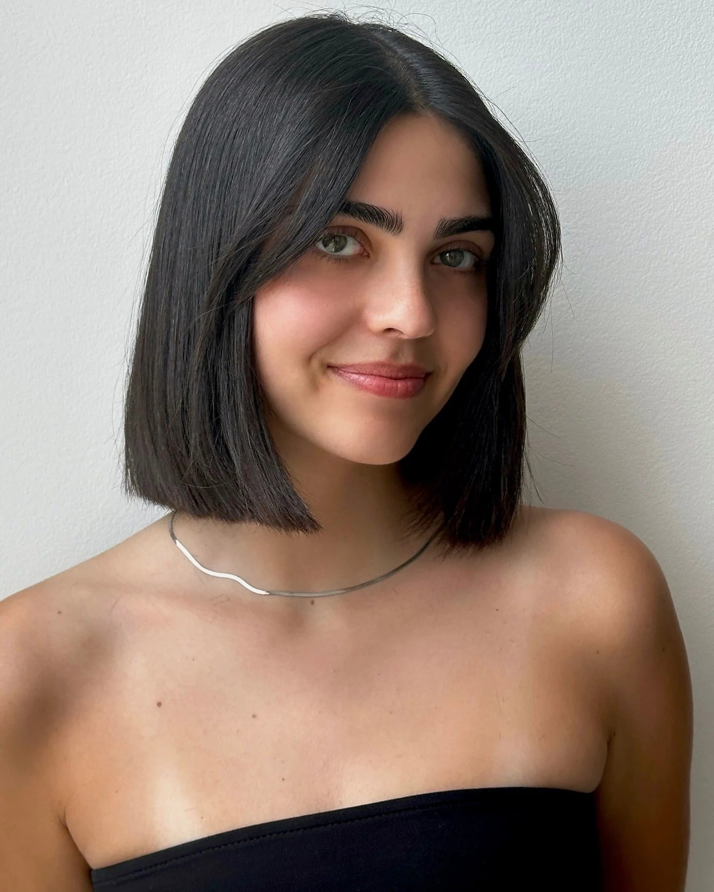 8. Center-Parted Sleek Bob with Deep Espresso Tone (Medium Bob Haircuts)