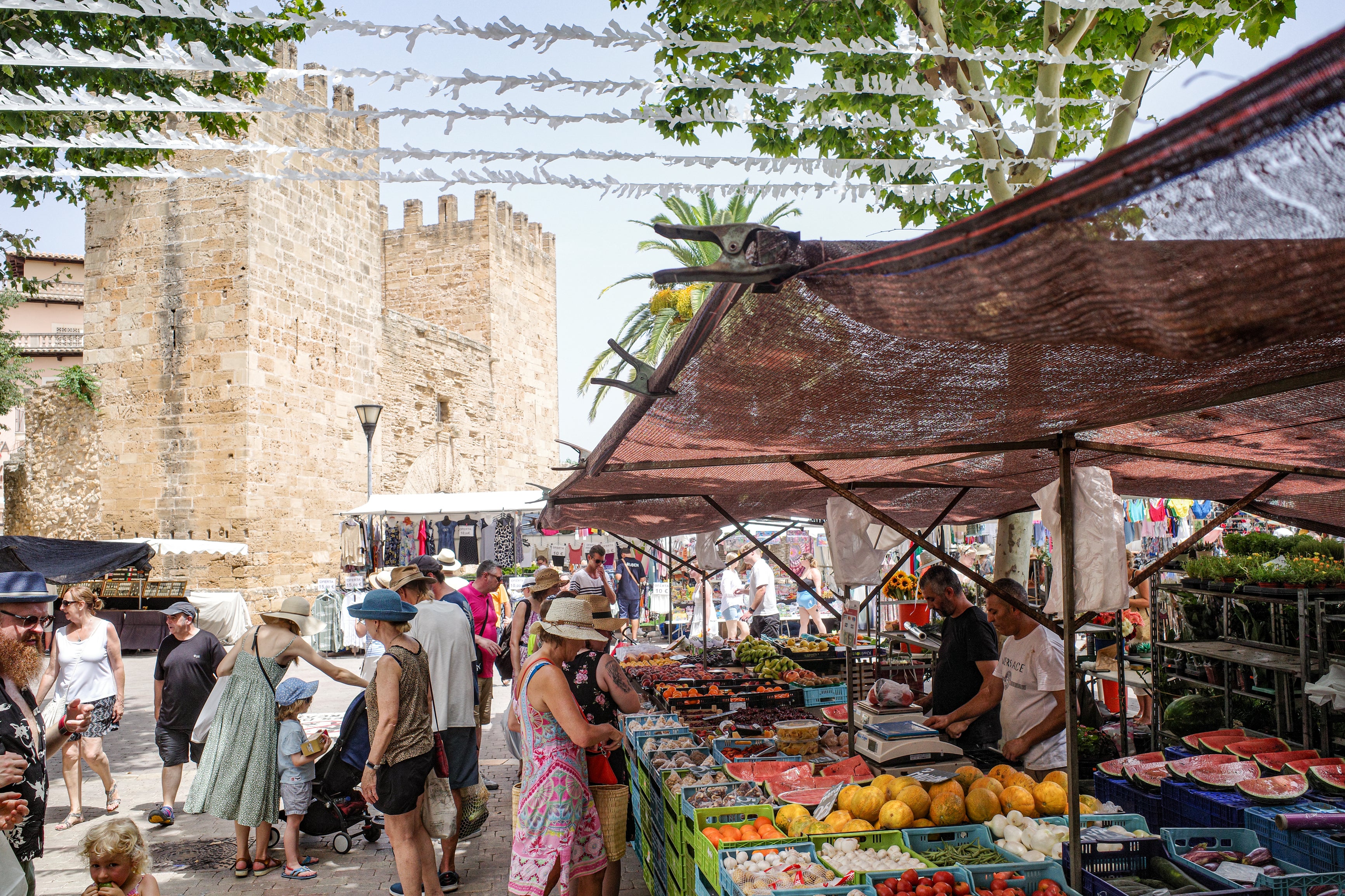 8. Go to the Alcúdia Market - Alcudia, Spain Market day in the Old town of Alcudia, Mallorca