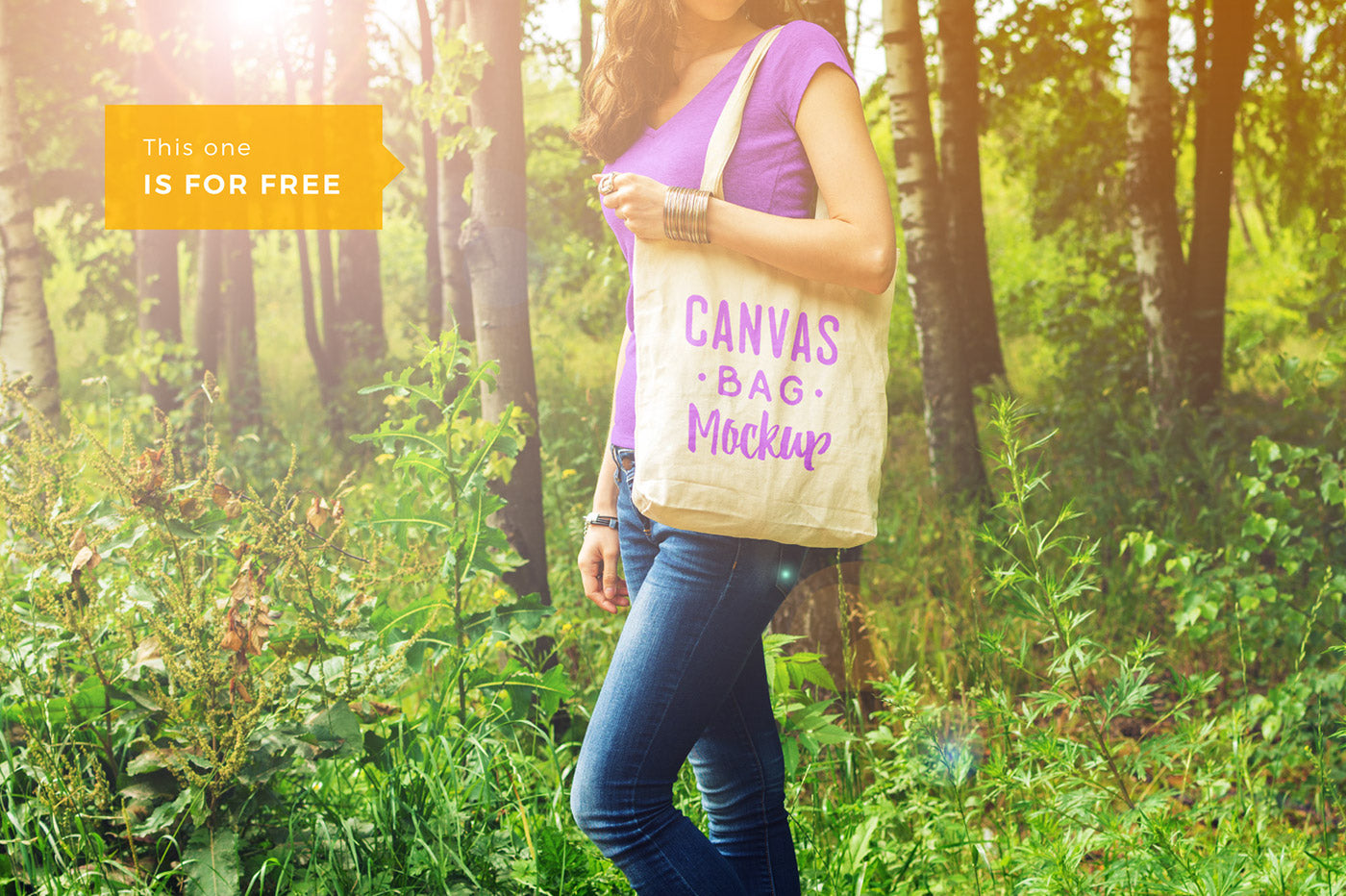 Download Free Woman Holding a Canvas Bag PSD Mockup - CreativeBooster